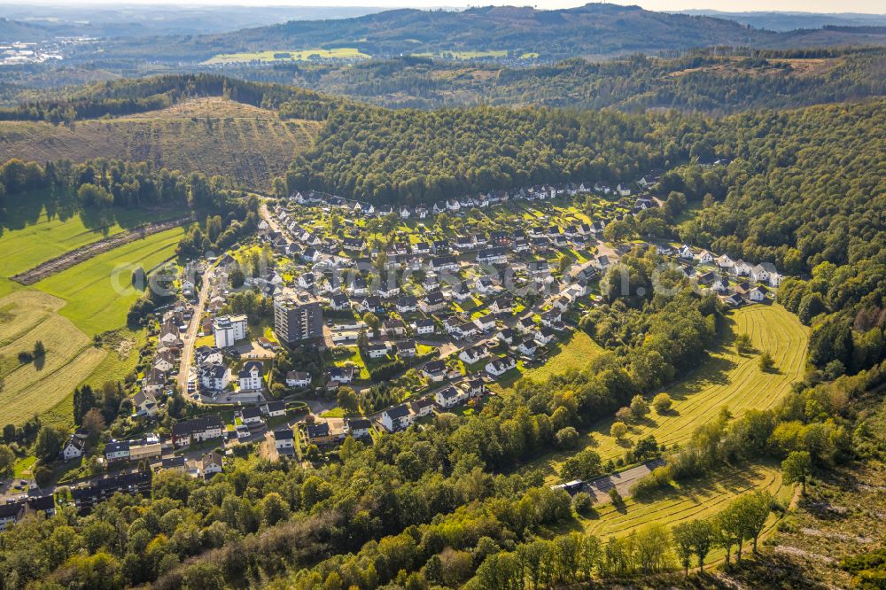 Hilchenbach from the bird's eye view: Village view on the edge of agricultural fields and land in Hilchenbach at Siegerland in the state North Rhine-Westphalia, Germany