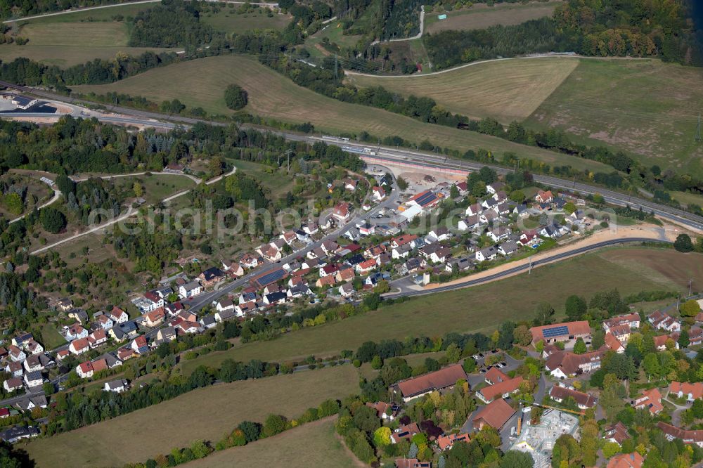 Hohenroth from the bird's eye view: Village view on the edge of agricultural fields and land in Hohenroth in the state Bavaria, Germany