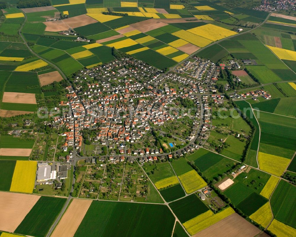 Aerial photograph Holzheim - Village view on the edge of agricultural fields and land in Holzheim in the state Hesse, Germany