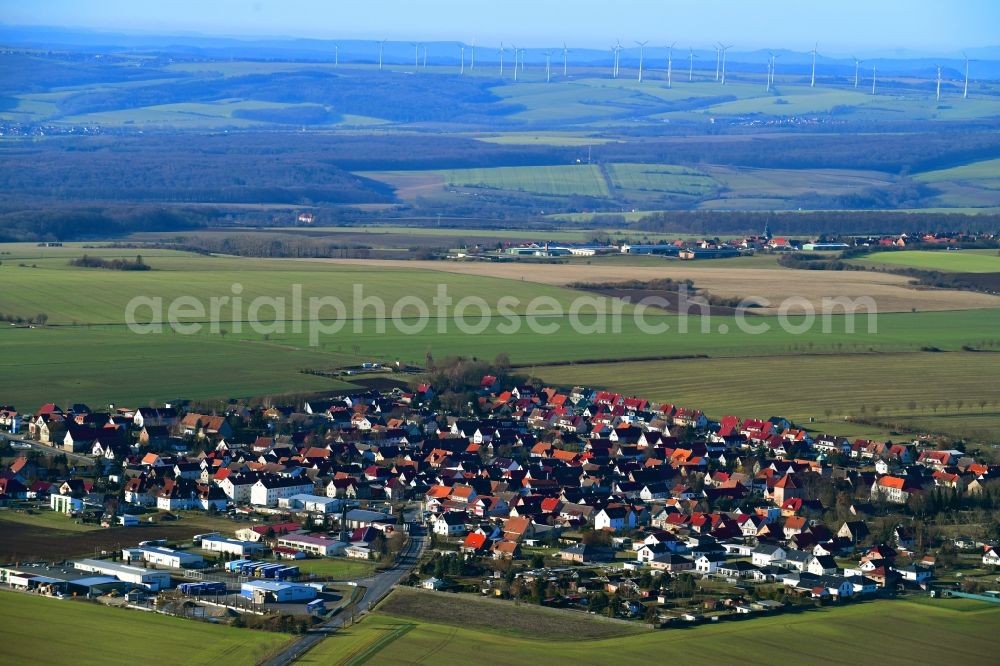 Aerial image Hüpstedt - Village view on the edge of agricultural fields and land in Huepstedt in the state Thuringia, Germany