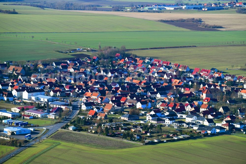 Hüpstedt from above - Village view on the edge of agricultural fields and land in Huepstedt in the state Thuringia, Germany