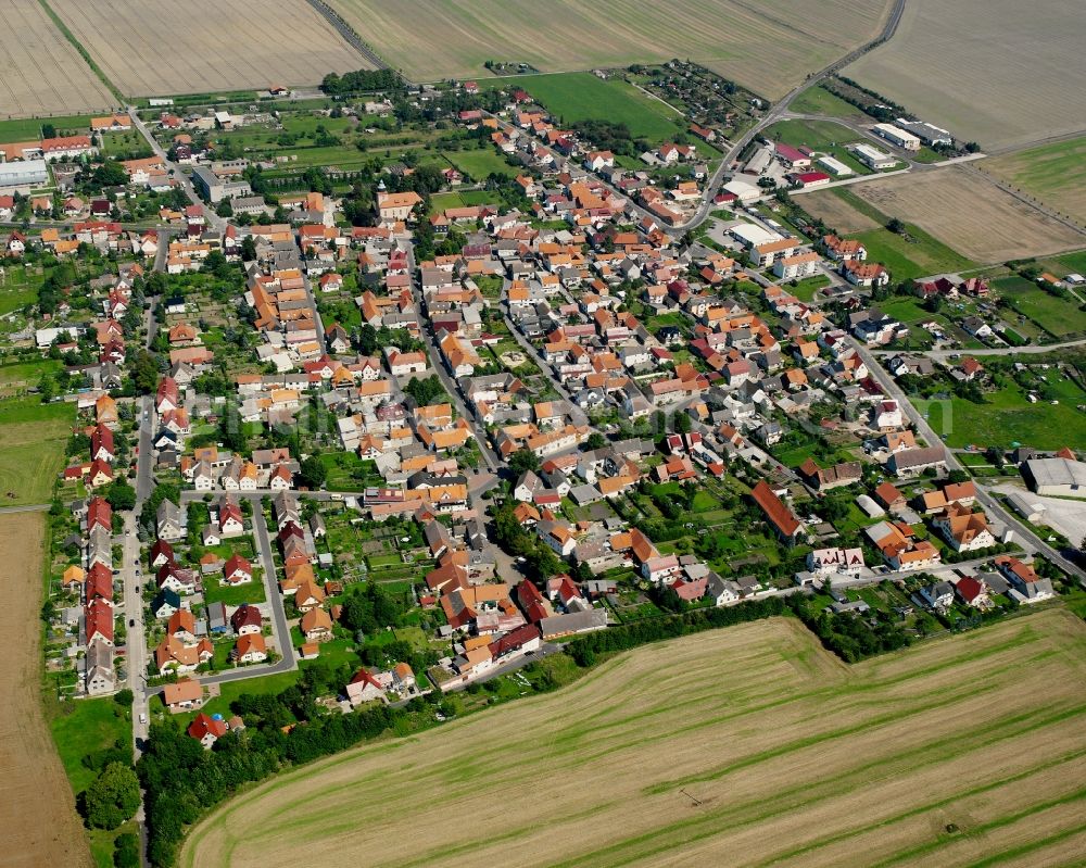 Hüpstedt from above - Village view on the edge of agricultural fields and land in Hüpstedt in the state Thuringia, Germany