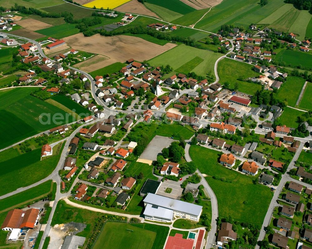 Johanniskirchen from the bird's eye view: Village view on the edge of agricultural fields and land in Johanniskirchen in the state Bavaria, Germany