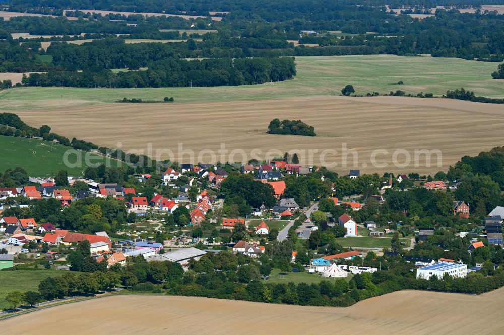 Kalkhorst from the bird's eye view: Village view on the edge of agricultural fields and land in Kalkhorst in the state Mecklenburg - Western Pomerania, Germany