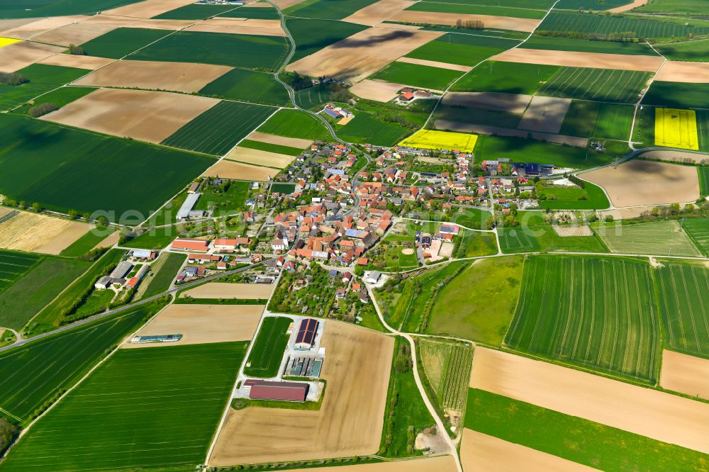 Kaltensondheim from the bird's eye view: Village view on the edge of agricultural fields and land in Kaltensondheim in the state Bavaria, Germany