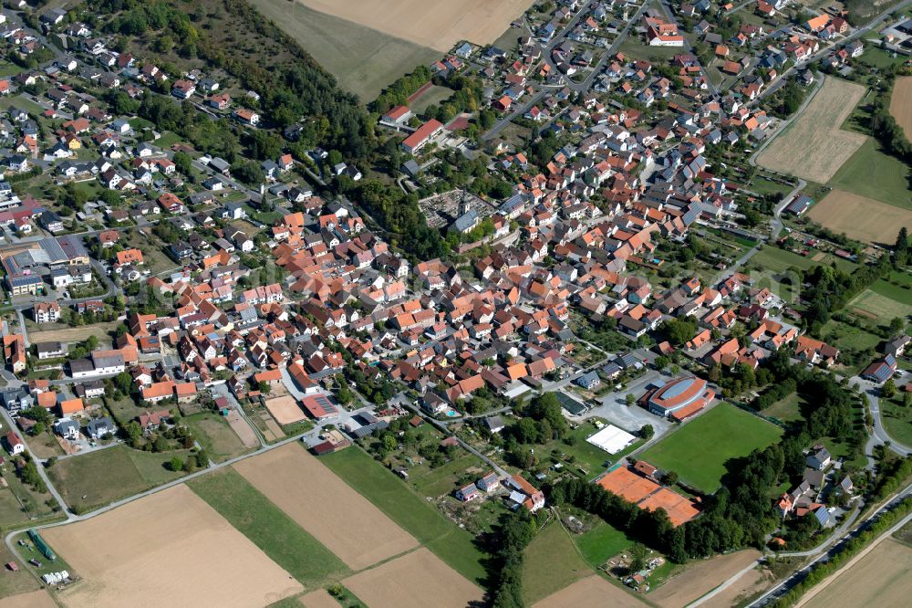 Aerial image Karbach - Village view on the edge of agricultural fields and land in Karbach in the state Bavaria, Germany