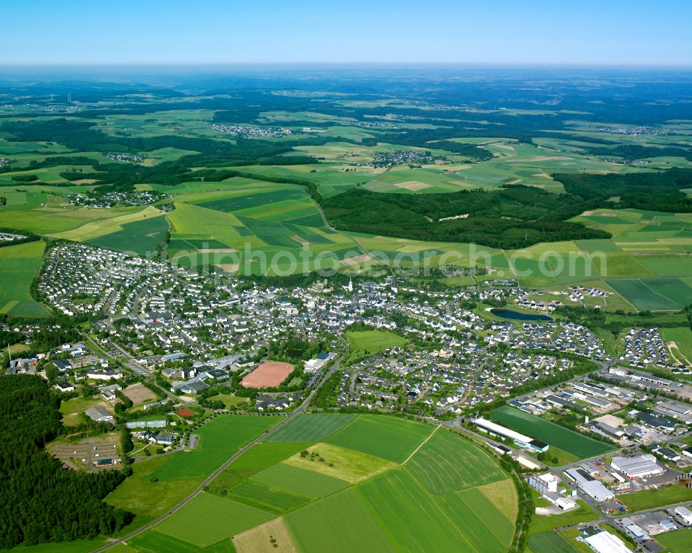 Kastellaun from above - Village view on the edge of agricultural fields and land in Kastellaun in the state Rhineland-Palatinate, Germany