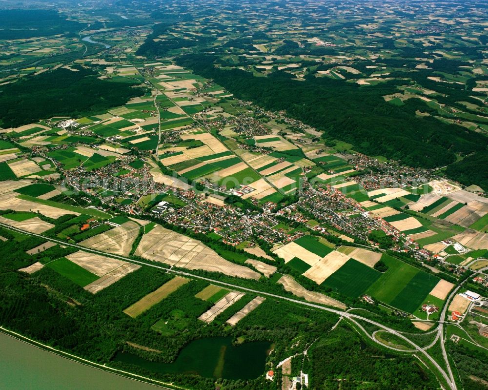 Kirchdorf am Inn from above - Village view on the edge of agricultural fields and land in Kirchdorf am Inn in the state Bavaria, Germany