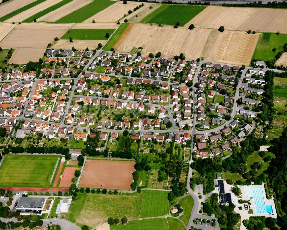 Kirchhausen from the bird's eye view: Village view on the edge of agricultural fields and land in Kirchhausen in the state Baden-Wuerttemberg, Germany