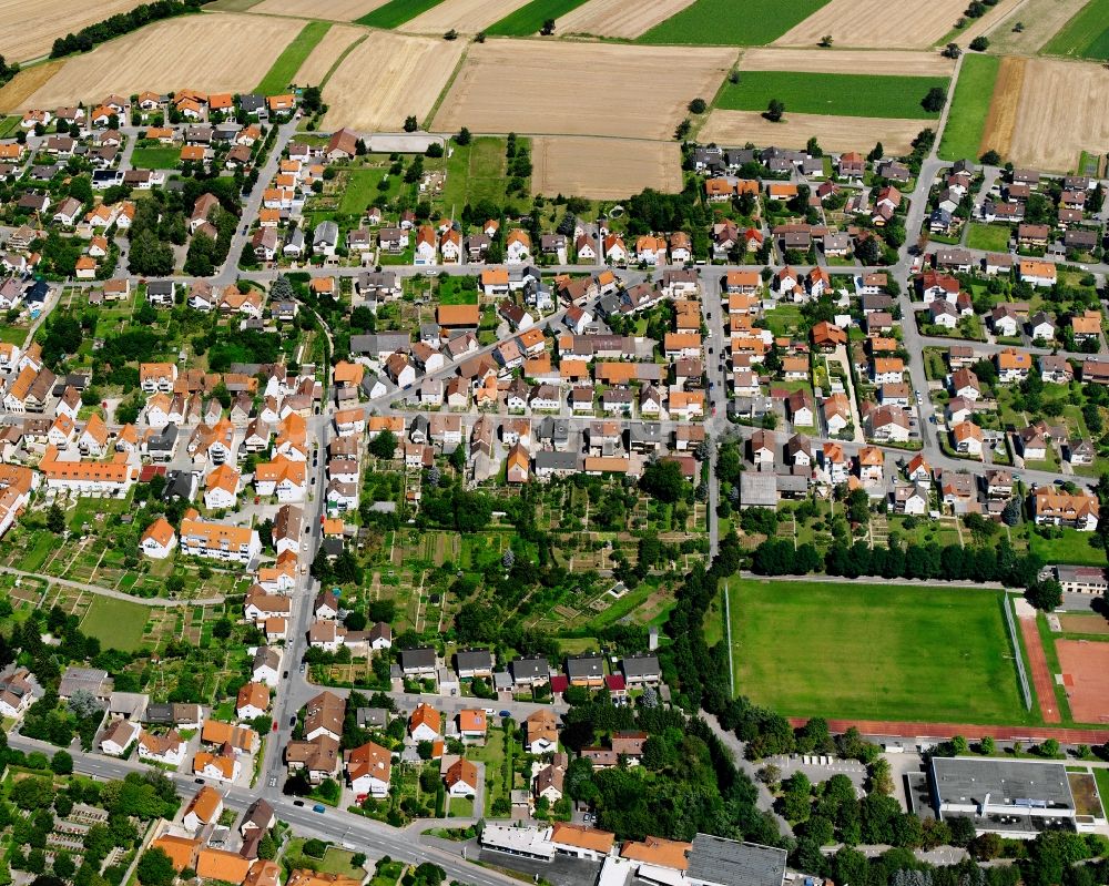 Aerial image Kirchhausen - Village view on the edge of agricultural fields and land in Kirchhausen in the state Baden-Wuerttemberg, Germany