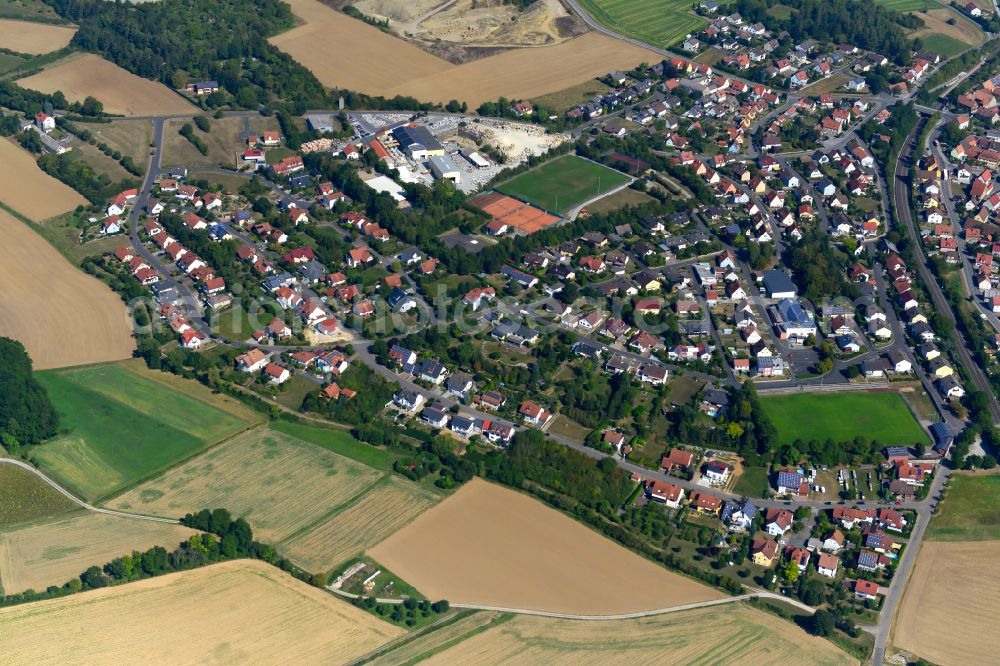 Kirchheim from above - Village view on the edge of agricultural fields and land in Kirchheim in the state Bavaria, Germany