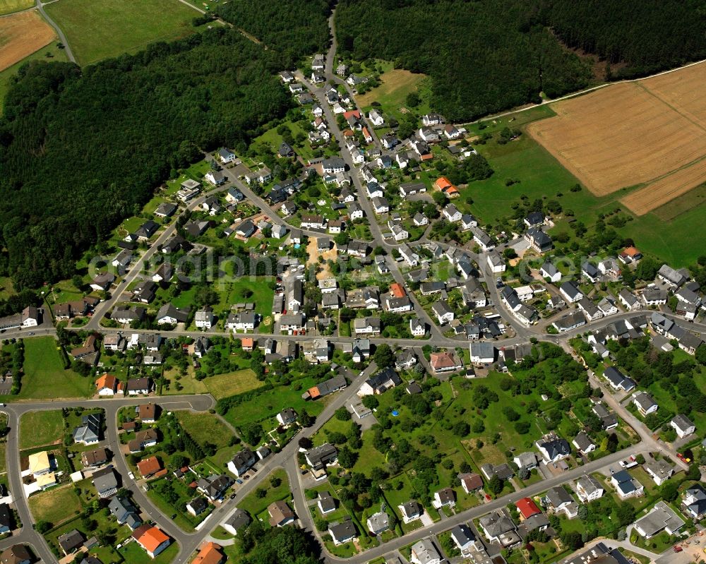 Kirschweiler from the bird's eye view: Village view on the edge of agricultural fields and land in Kirschweiler in the state Rhineland-Palatinate, Germany