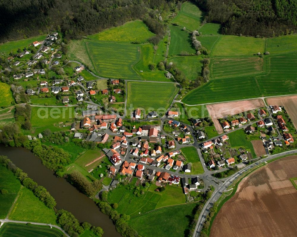 Kohlhausen from the bird's eye view: Village view on the edge of agricultural fields and land in Kohlhausen in the state Hesse, Germany