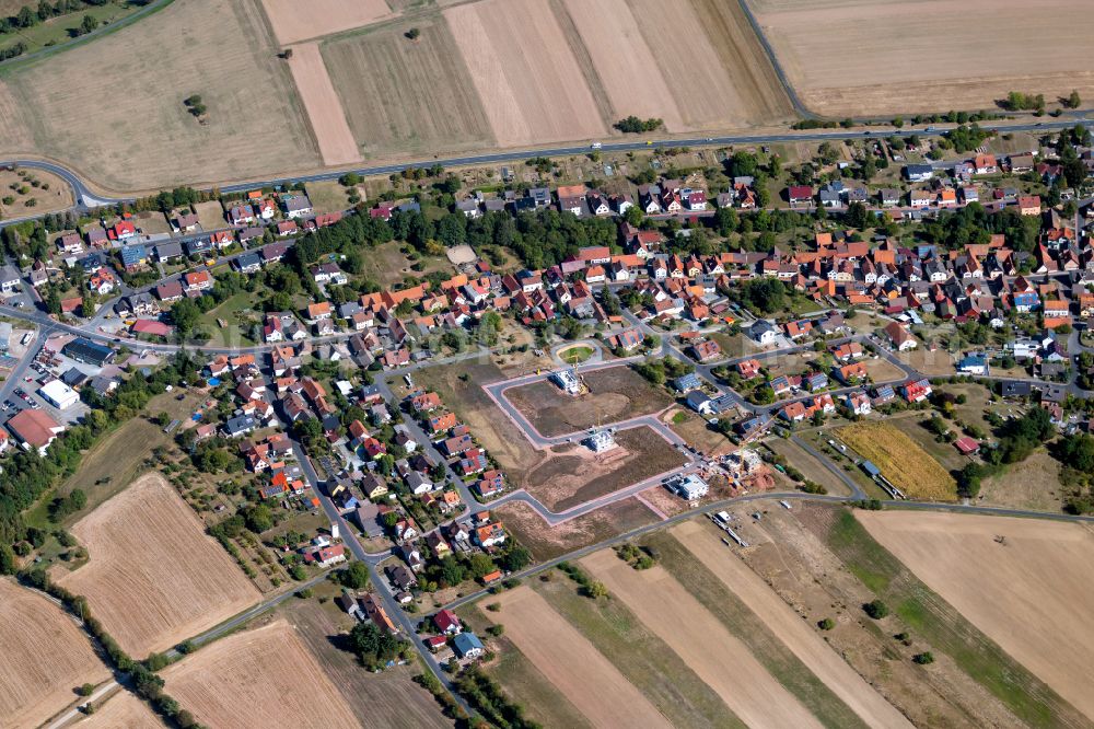 Kredenbach from above - Village view on the edge of agricultural fields and land in Kredenbach in the state Bavaria, Germany