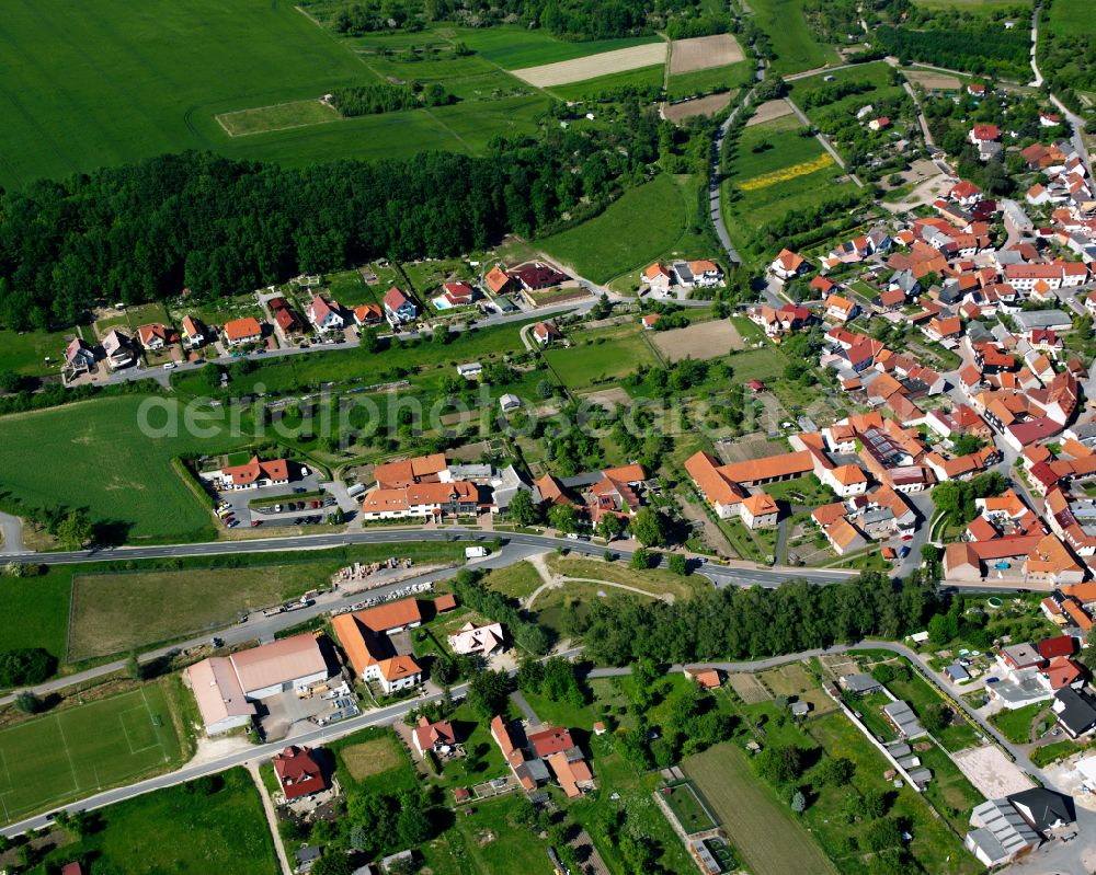 Kreuzebra from above - Village view on the edge of agricultural fields and land on street Hauptstrasse in Kreuzebra in the state Thuringia, Germany