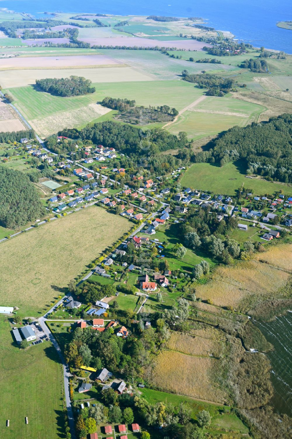 Lütow from above - Village view on the edge of agricultural fields and land on Kueste of Ostsee in Luetow in the state Mecklenburg - Western Pomerania, Germany