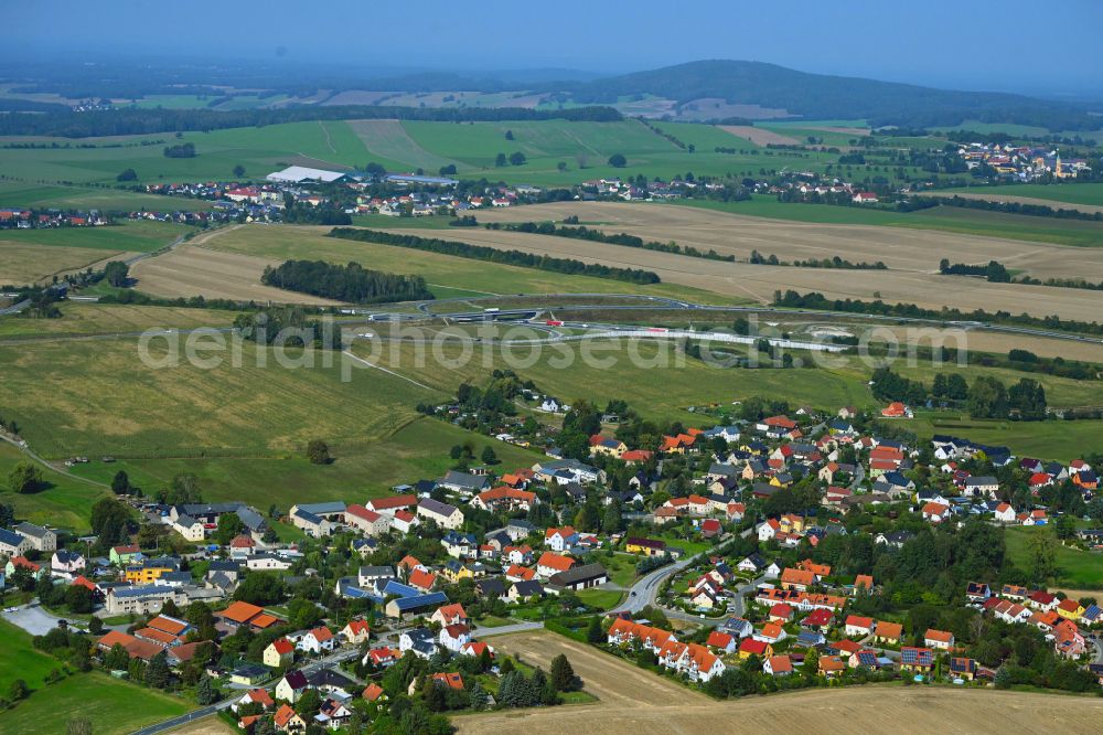 Aerial image Leppersdorf - Village view on the edge of agricultural fields and land on street S95 in Leppersdorf in the state Saxony, Germany