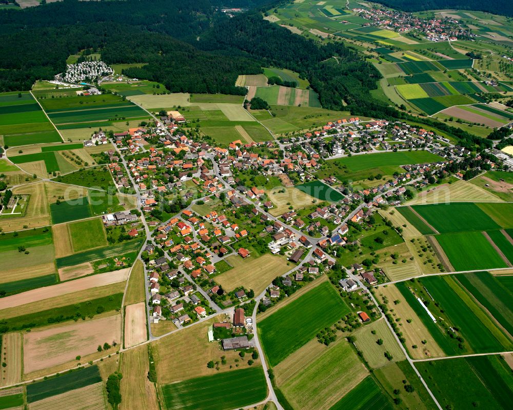 Liebelsberg from the bird's eye view: Village view on the edge of agricultural fields and land in Liebelsberg in the state Baden-Wuerttemberg, Germany