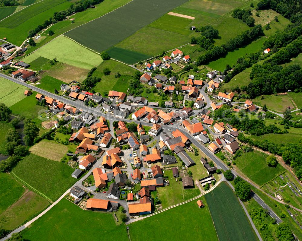 Aerial image Üllershausen - Village view on the edge of agricultural fields and land in Üllershausen in the state Hesse, Germany