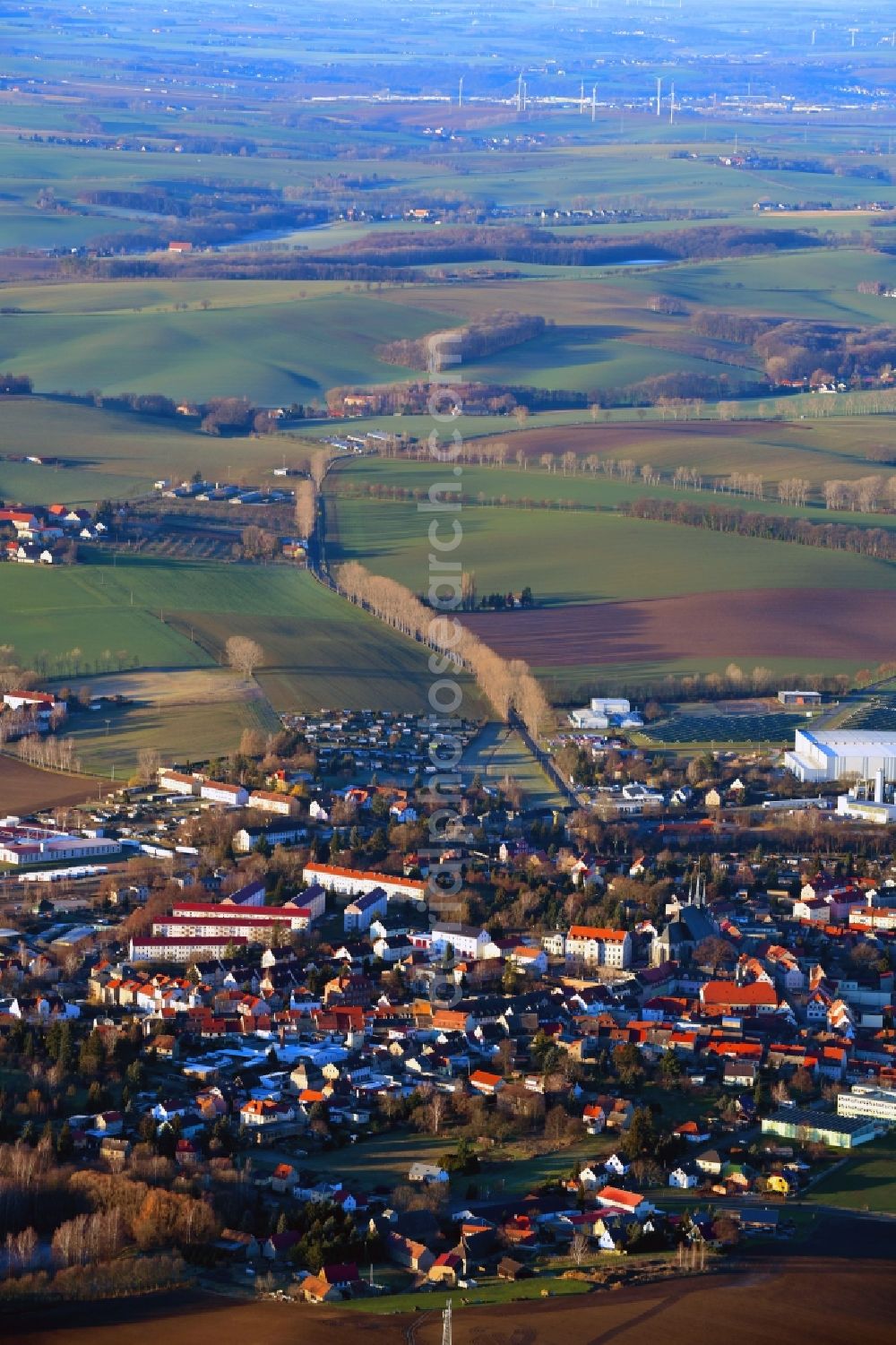 Lommatzsch from the bird's eye view: Village view on the edge of agricultural fields and land in Lommatzsch in the state Saxony, Germany