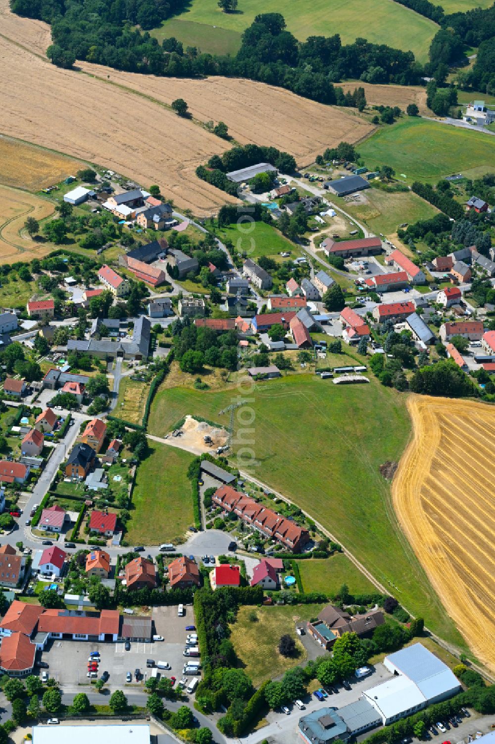 Lotzdorf from the bird's eye view: Village view on the edge of agricultural fields and land in Lotzdorf in the state Saxony, Germany