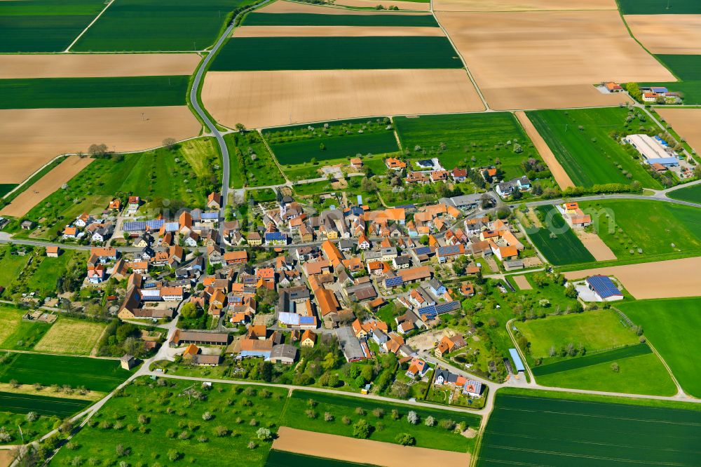 Aerial image Markt Herrnsheim - Village view on the edge of agricultural fields and land in Markt Herrnsheim in the state Bavaria, Germany