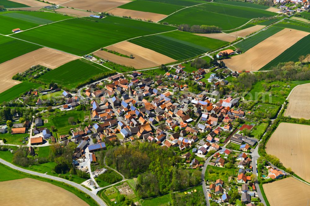 Aerial image Martinsheim - Village view on the edge of agricultural fields and land in Martinsheim in the state Bavaria, Germany