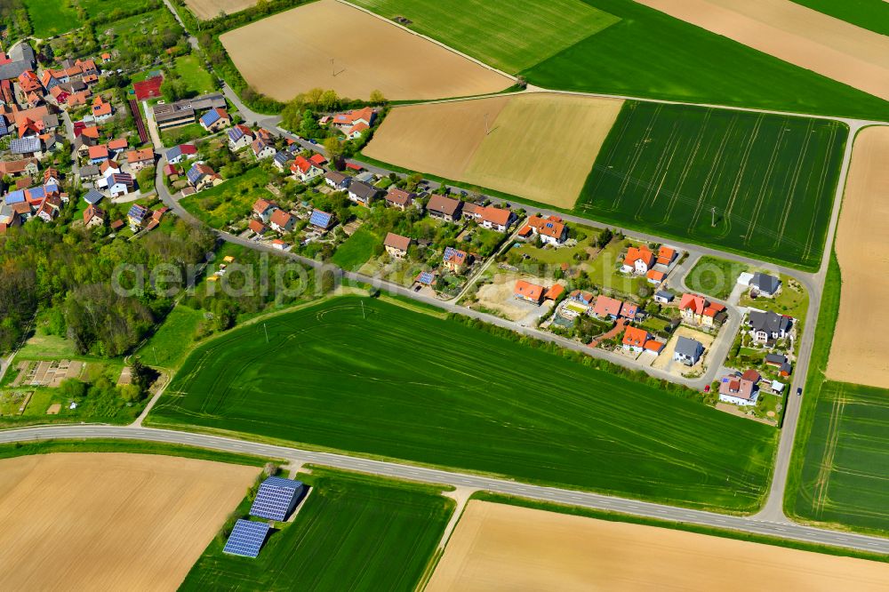 Aerial photograph Martinsheim - Village view on the edge of agricultural fields and land in Martinsheim in the state Bavaria, Germany