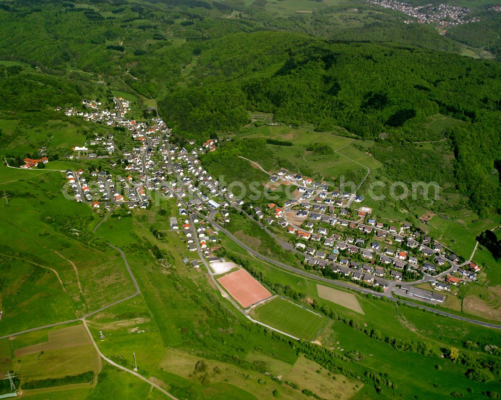 Medenbach from the bird's eye view: Village view on the edge of agricultural fields and land in Medenbach in the state Hesse, Germany