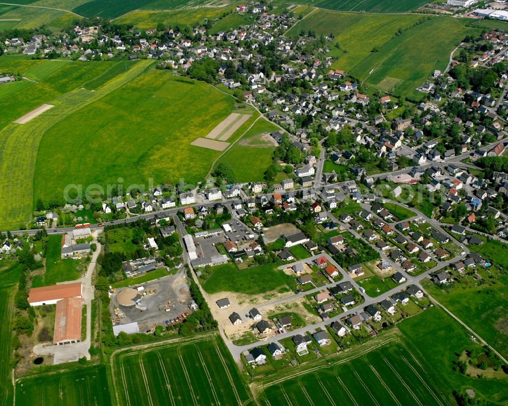 Mühlau from the bird's eye view: Village view on the edge of agricultural fields and land in Mühlau in the state Saxony, Germany