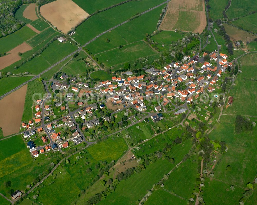 Michelbach from the bird's eye view: Village view on the edge of agricultural fields and land in Michelbach in the state Hesse, Germany