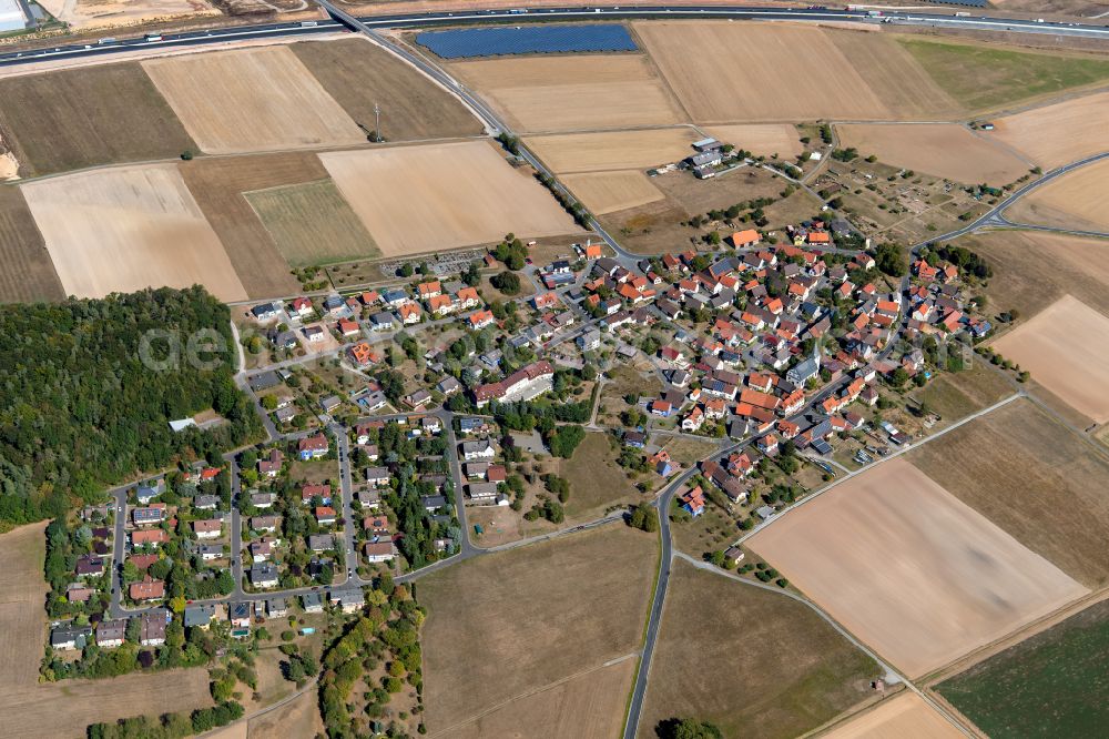 Aerial image Michelrieth - Village view on the edge of agricultural fields and land in Michelrieth in the state Bavaria, Germany