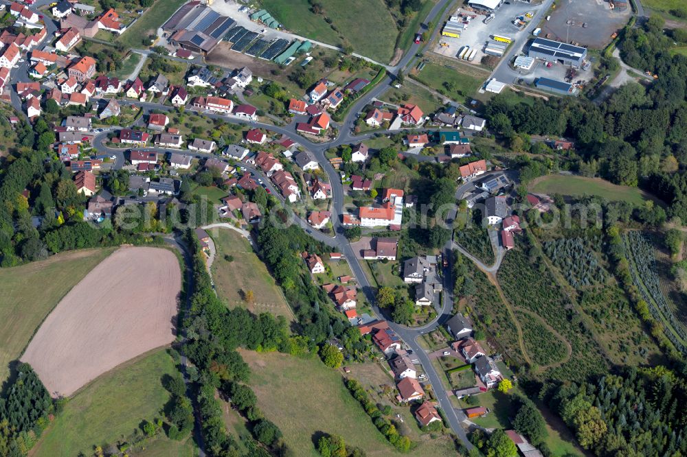 Mittelsinn from the bird's eye view: Village view on the edge of agricultural fields and land in Mittelsinn in the state Bavaria, Germany