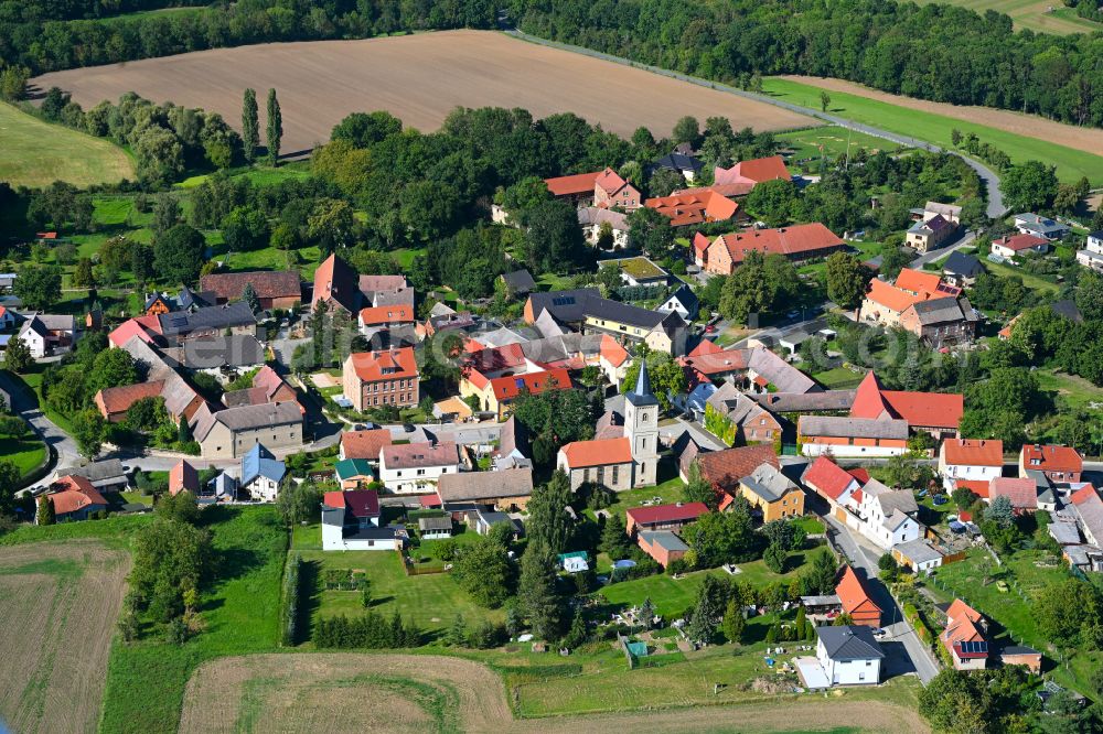 Molauer Land from the bird's eye view: Village view on the edge of agricultural fields and land in Molauer Land in the state Saxony-Anhalt, Germany