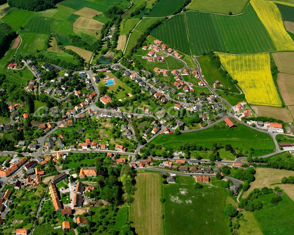 Nentershausen from above - Village view on the edge of agricultural fields and land in Nentershausen in the state Hesse, Germany