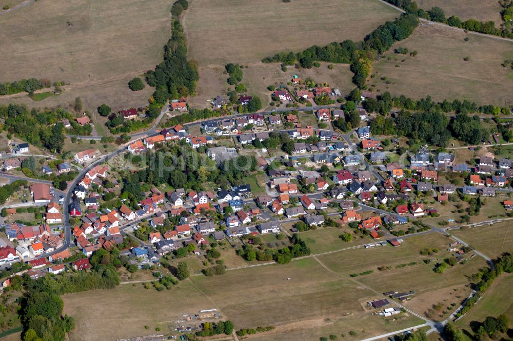 Aerial photograph Neuhütten - Village view on the edge of agricultural fields and land in Neuhütten in the state Bavaria, Germany