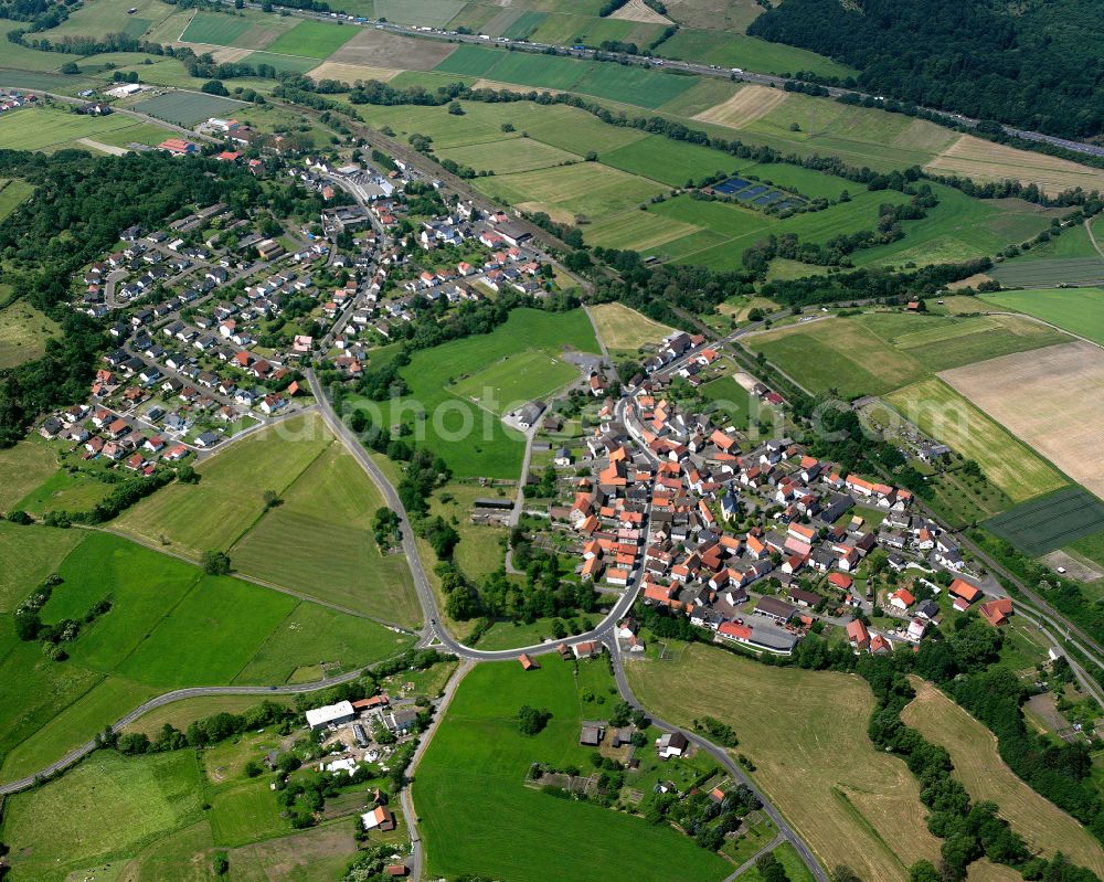 Nieder-Gemünden from above - Village view on the edge of agricultural fields and land in Nieder-Gemünden in the state Hesse, Germany