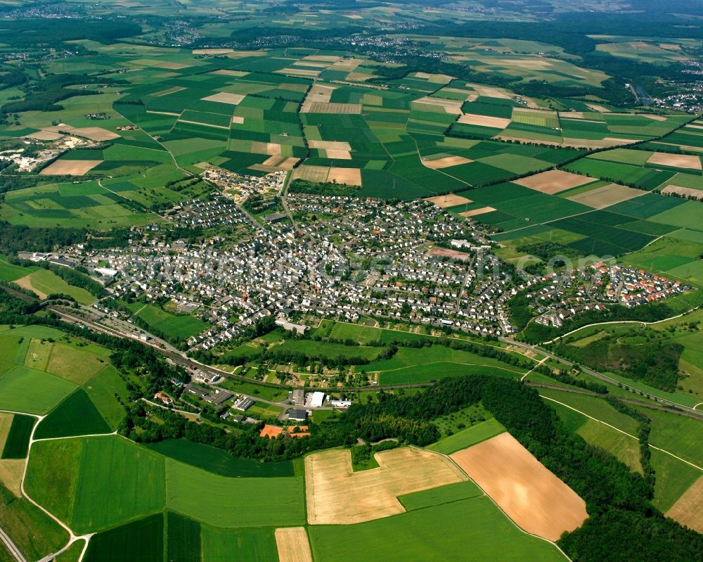 Aerial image Niederbrechen - Village view on the edge of agricultural fields and land in Niederbrechen in the state Hesse, Germany