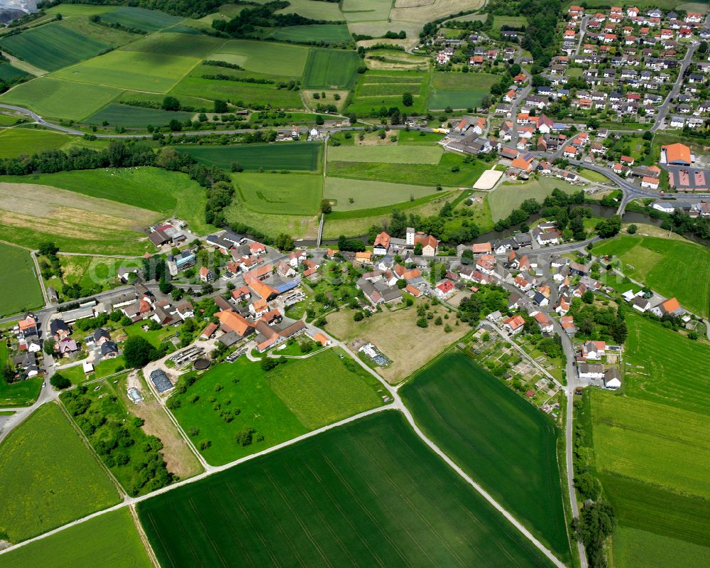 Ober-Ofleiden from above - Village view on the edge of agricultural fields and land in Ober-Ofleiden in the state Hesse, Germany