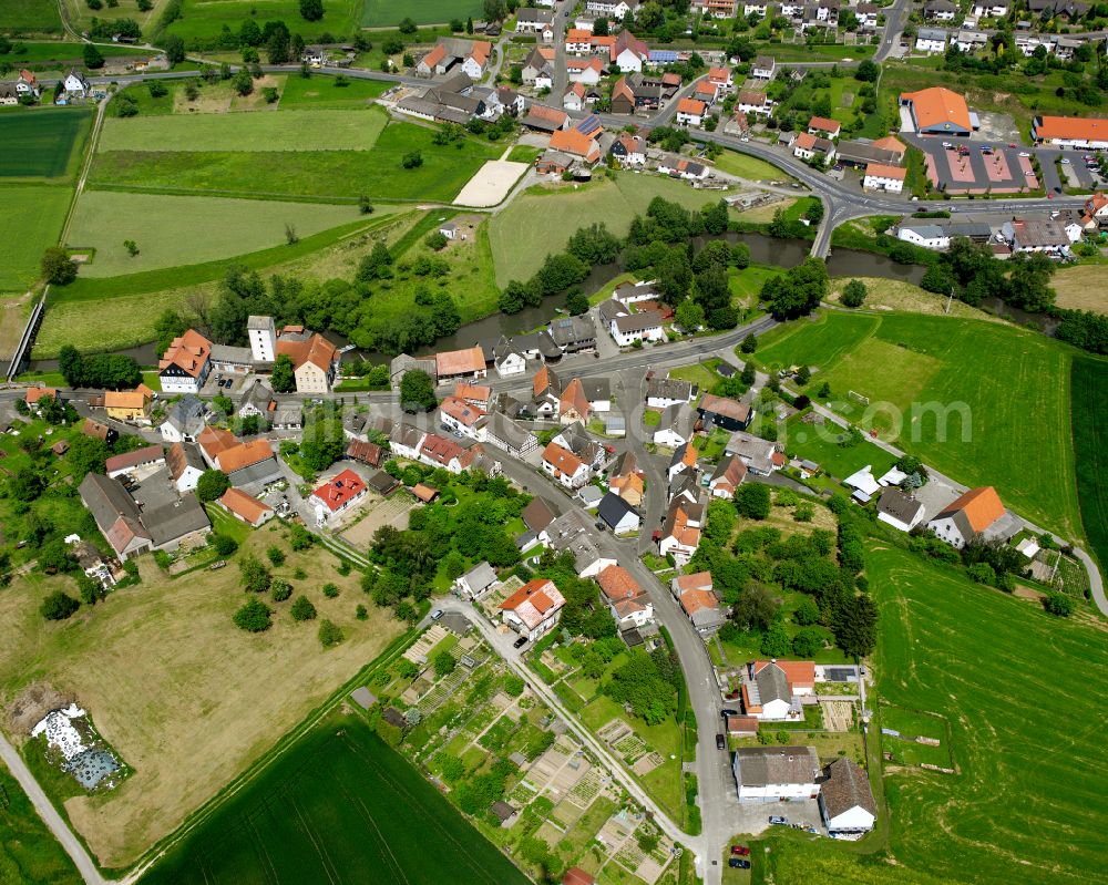 Ober-Ofleiden from the bird's eye view: Village view on the edge of agricultural fields and land in Ober-Ofleiden in the state Hesse, Germany