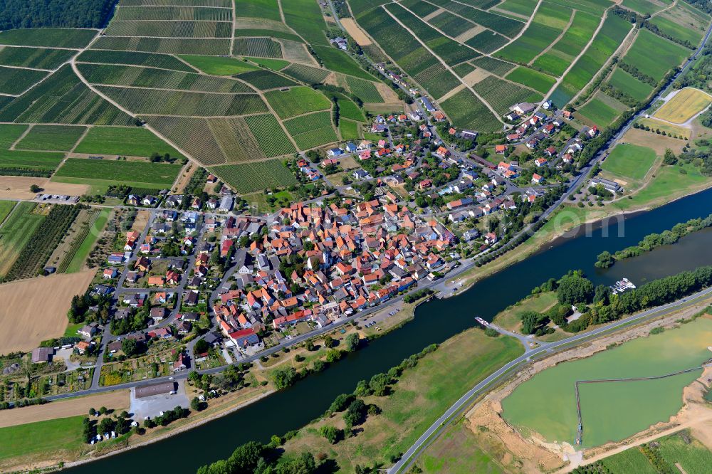 Obereisenheim from above - Village view on the edge of agricultural fields and land in Obereisenheim in the state Bavaria, Germany