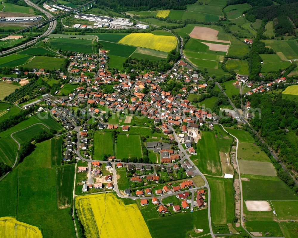 Obergeis from the bird's eye view: Village view on the edge of agricultural fields and land in Obergeis in the state Hesse, Germany