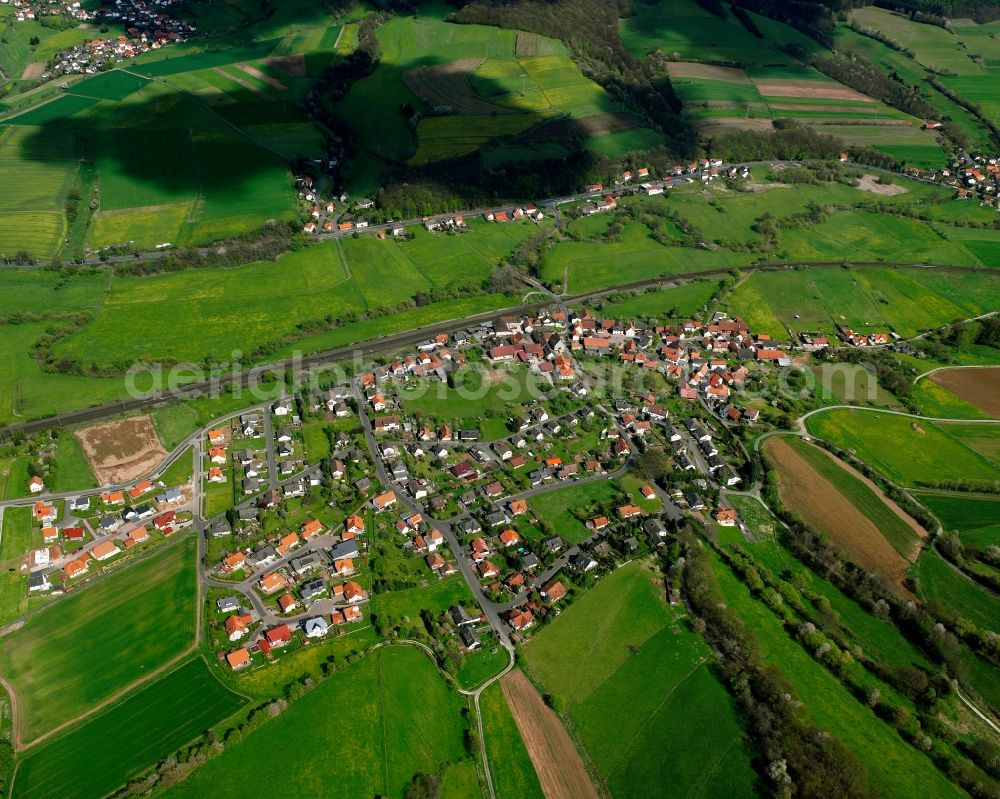 Oberhaun from above - Village view on the edge of agricultural fields and land in Oberhaun in the state Hesse, Germany