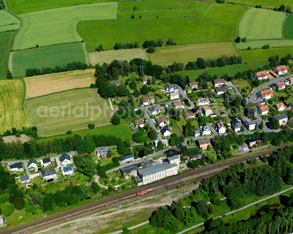 Oberkotzau from the bird's eye view: Village view on the edge of agricultural fields and land on street An der Veida in Oberkotzau in the state Bavaria, Germany