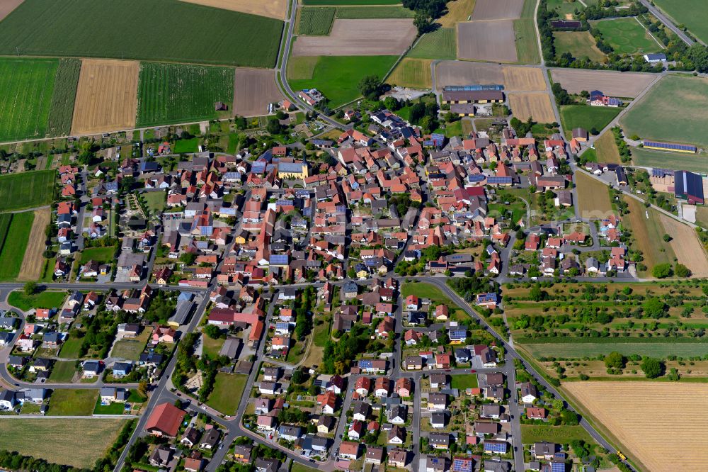 Oberpleichfeld from above - Village view on the edge of agricultural fields and land in Oberpleichfeld in the state Bavaria, Germany