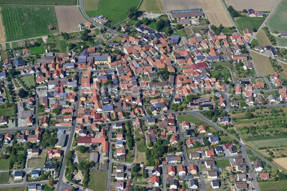 Oberpleichfeld from the bird's eye view: Village view on the edge of agricultural fields and land in Oberpleichfeld in the state Bavaria, Germany