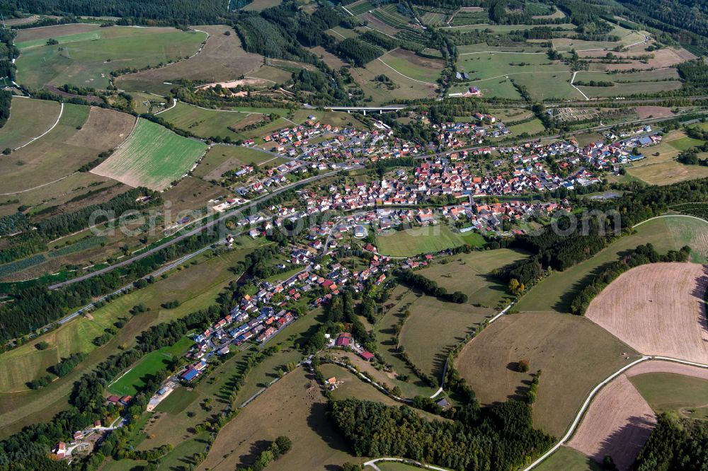 Obersinn from the bird's eye view: Village view on the edge of agricultural fields and land in Obersinn in the state Bavaria, Germany