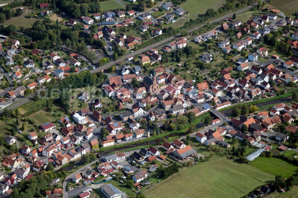 Aerial image Obersinn - Village view on the edge of agricultural fields and land in Obersinn in the state Bavaria, Germany