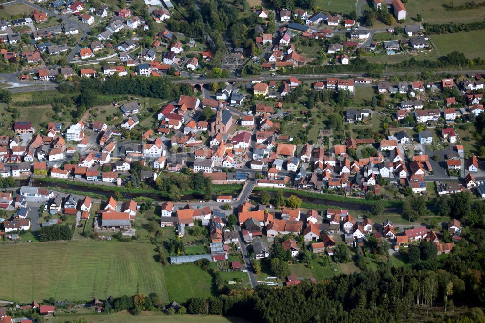 Obersinn from above - Village view on the edge of agricultural fields and land in Obersinn in the state Bavaria, Germany