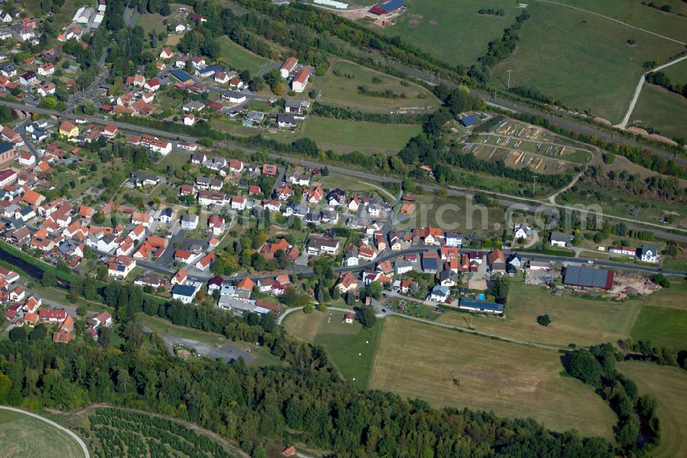 Obersinn from the bird's eye view: Village view on the edge of agricultural fields and land in Obersinn in the state Bavaria, Germany